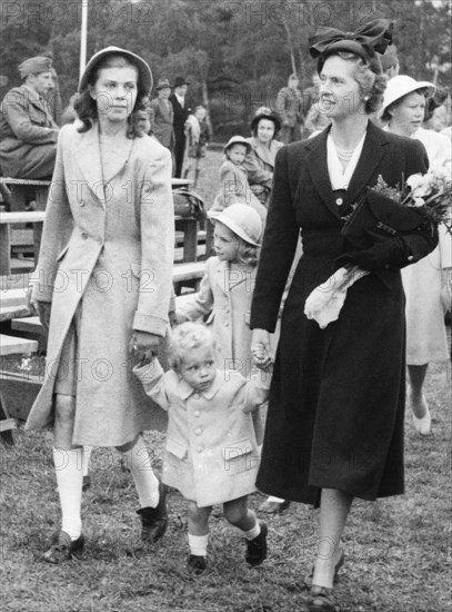 Crown Prince Carl Gustav with mother Sibylla and big sister Margaretha, Stockholm, 1947.  Creator: Unknown.