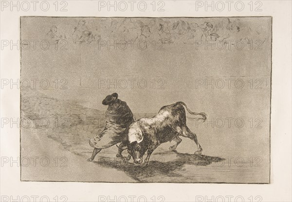 Plate 14 from the 'Tauromaquia': The very skillful student of Falces, wrapped in his cape..., 1816. Creator: Francisco Goya.