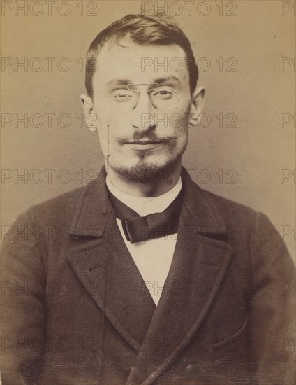 Moucheraud. Adrien, Eugène. 28 ans, né à Paris IVe. Imprimeur. Anarchiste. 4/3/94., 1894.
