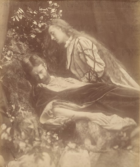 Gareth and Lynette, 1874. A bearded man (Andrew Hichens) poses as Gareth reclining with head cast down and eyes closed. A woman (May Prinsep Hichens), poses as Lynette, standing and leaning above him with unbound hair and her left hand resting on his chest. A photographic illustration to Alfred Tennyson's "Idylls of the King"; a series of narrative poems based on the legends of King Arthur.