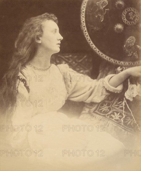 Elaine the Lily - Maid of Astolat, 1874. A seated woman (May Prinsep) in profile with long unbound hair. A photographic illustration to Alfred Tennyson's "Idylls of the King"; a series of narrative poems based on the legends of King Arthur.