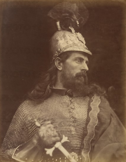 King Arthur, September 1874. A photograph of the torso and head in profile of a bearded and long-haired knight (William Warder) with helmet and chainmail gripping a sword. A photographic illustration to Alfred Tennyson's "Idylls of the King"; a series of narrative poems based on the legends of King Arthur.