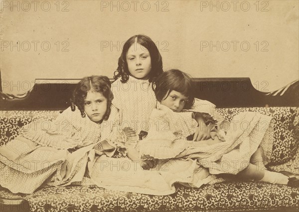 Edith, Ina and Alice Liddell on a Sofa, Summer 1858.