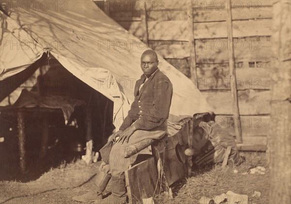 [Black Soldier in Camp], ca. 1863.