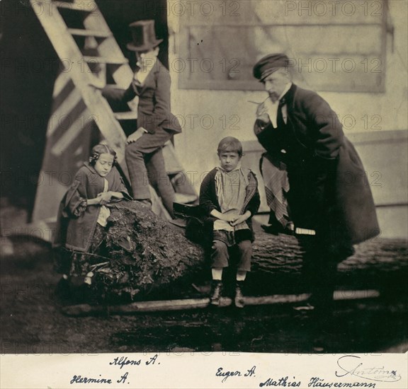 [Hermine, Alfons and Eugen Antoine and Mathias Höusermann on a fallen tree], 1850s-60s.