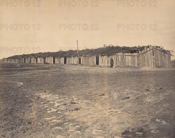 Civil War View, 1860s. (Section of log stalls [?] at City Point Virginia).