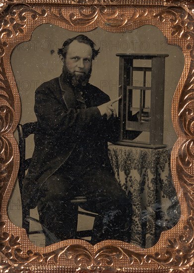 Seated Man Demonstrating Vertical Sliding Window Model, late 1850s-60s.