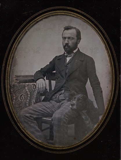 Man Seated at Table with Dog, 1840s.