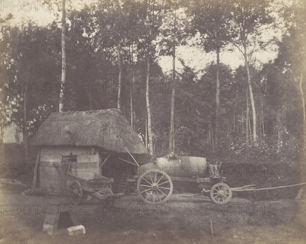 Charette devant l'entrée d'un abri au toit de chaume, 1850-53.