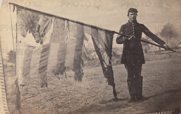 Sergeant Alex Rogers with Battle Flag, Eighty-third Pennsylvania Volunteers, Third Brigade, First Division, Fifth Corps, Army of the Potomac, ca. 1863.