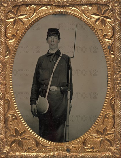 Civil War Union Soldier with Rifle and Canteen, in Studio, 1861-65.
