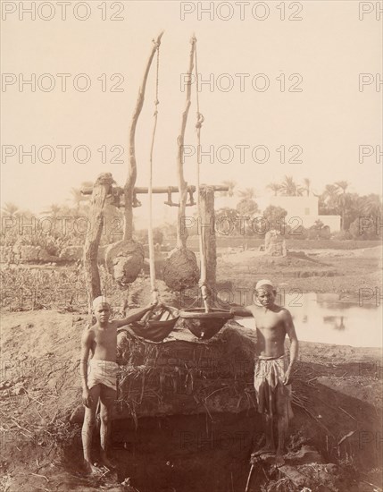 Two Boys Beside a Well, 1880s.