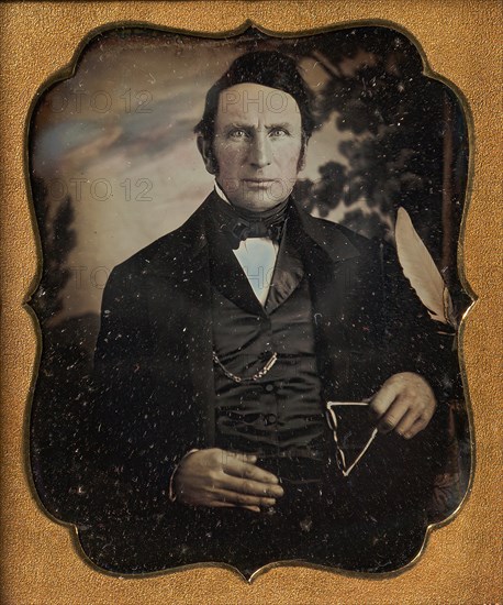 Man Holding Glasses in Front of Painted Outdoor Backdrop, 1850s.