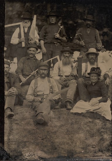 A Woman and Eight Carpenters Posed Outdoors, 1880s.