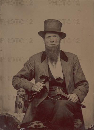 Man in Top Hat Holding a Hammer and Wrench, 1860s- early 70s.