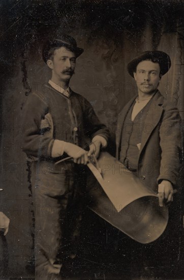 Two Tinsmiths Cutting a Curled Sheet of Metal, 1880s.