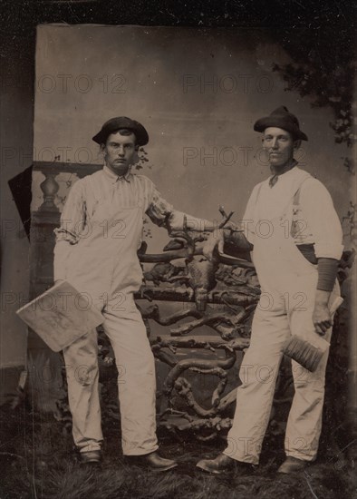 Two Plasterers in Overalls Leaning on a Rustic Fence, 1870s-80s.