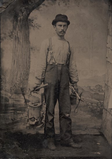 Tinsmith in Front of Painted Outdoor Backdrop, 1860s-70s.