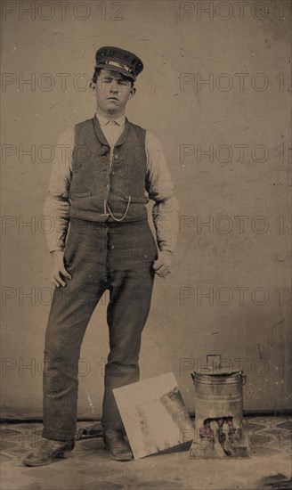 Tinsmith with Coal Heater and Sheet of Tin, 1870s-80s.
