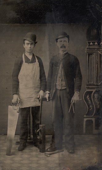 Two Carpenters with a Handsaw, Wood Plane, Hammer, Compass, and Square, 1880s.