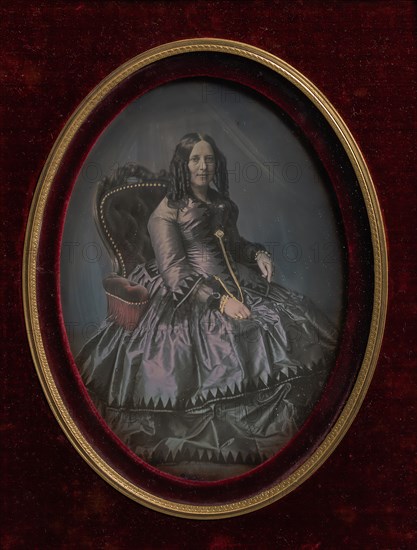 Finely Dressed Woman Seated in Armchair, 1850s.