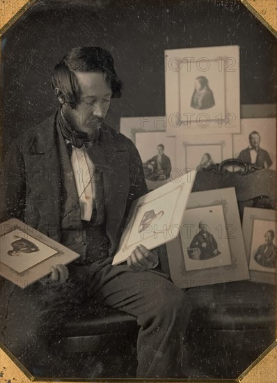 Frederick Langenheim Looking at Talbotypes, ca. 1849-51.