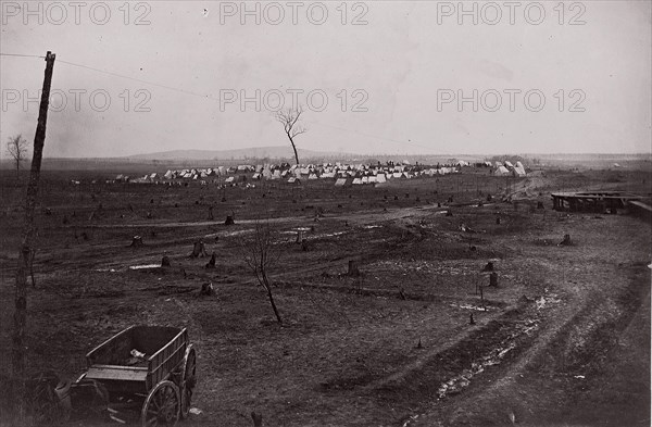 [Wagon in a landscape with army encampment in the distance]. Brady album, p. 125, 1861-65. Formerly attributed to Mathew B. Brady.