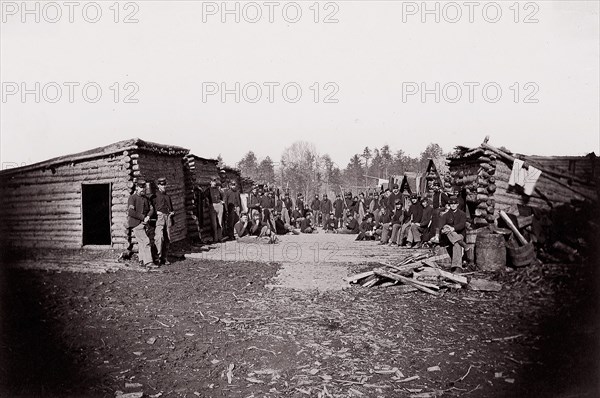 [Winter Quarters, troops with row of cabins]. Brady album, p. 128, 1861-65. Formerly attributed to Mathew B. Brady.