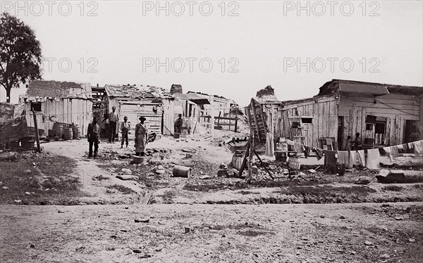 [Encampment with shacks and laundry]. Brady album, p. 129, 1861-65. Formerly attributed to Mathew B. Brady.