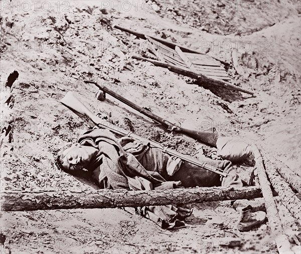 Dead Confederate Soldier at Fort Mahone, Petersburg, 1864. Formerly attributed to Mathew B. Brady.