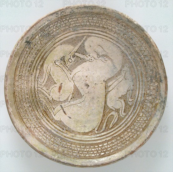 Bowl with Three Animals, Byzantine, 1100-1300. long-eared rabbit with a large panther and a deer.