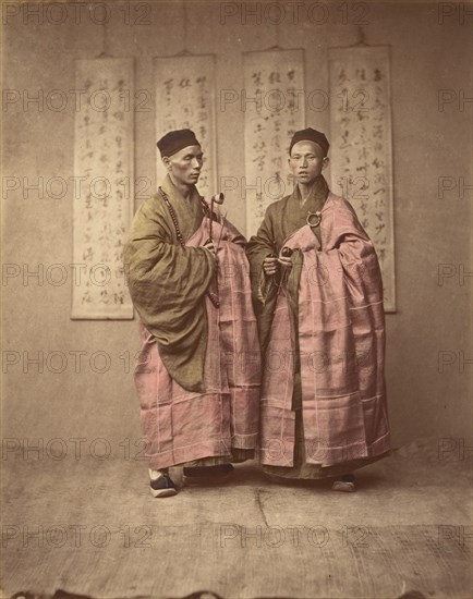 [Two Chinese Men in Matching Traditional Dress], 1870s.