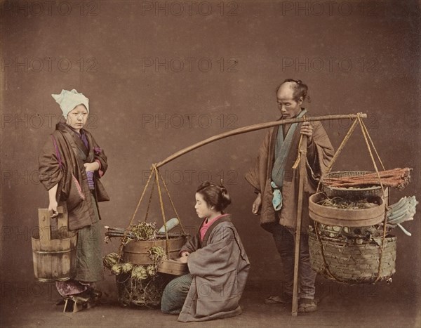 Two Japanese Women and One Japanese Man Posing with Water Bucket and Baskets], 1870s.
