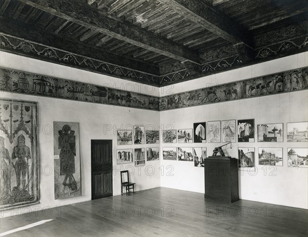 Bayeux Tapestry, early 20th century (original dated 11th century). [Cloisters. Arcn. Spanish Room. Museum View. Looking SW. (Exhibition of Medieval Knight & his Fortress, 1940)].