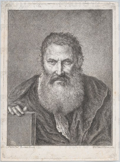Portrait of a bearded man holding a book
