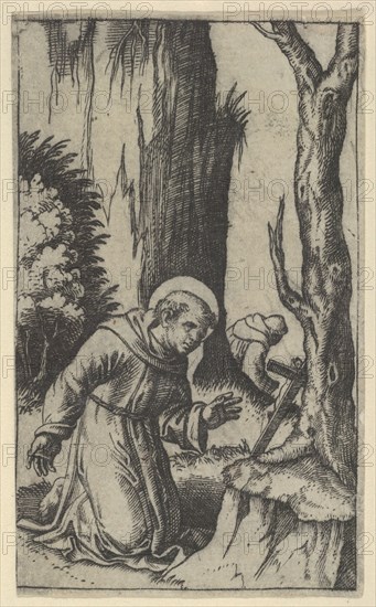 Saint Francis of Assisi praying before a crucifix