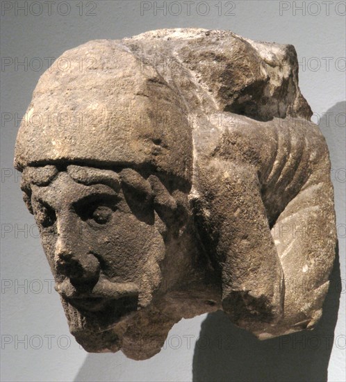 Corbel with Crouching Male Figure