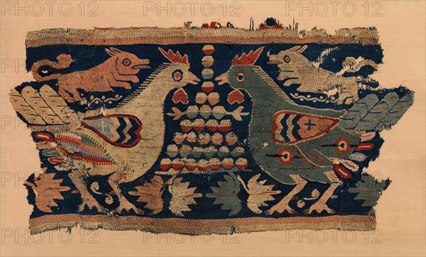 Fragment of Wall Hanging with confronted cocks and running dogs, Coptic, 4th-6th century.