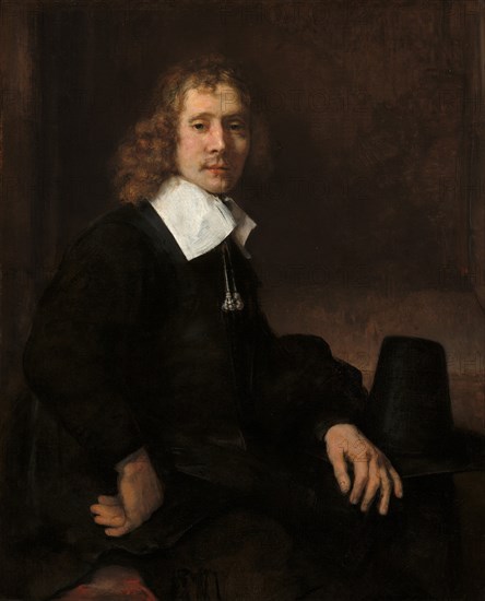 A Young Man Seated at a Table