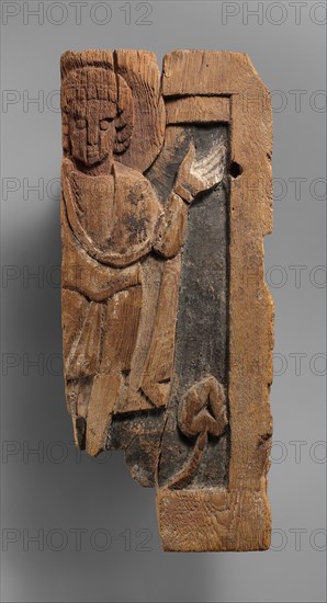 Fragmentary Carved Panel with a Saint