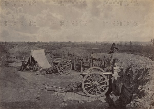 Rebel Works in Front of Atlanta, GA, No. 4, 1864. Union soldier sits on earthworks with a view of the city