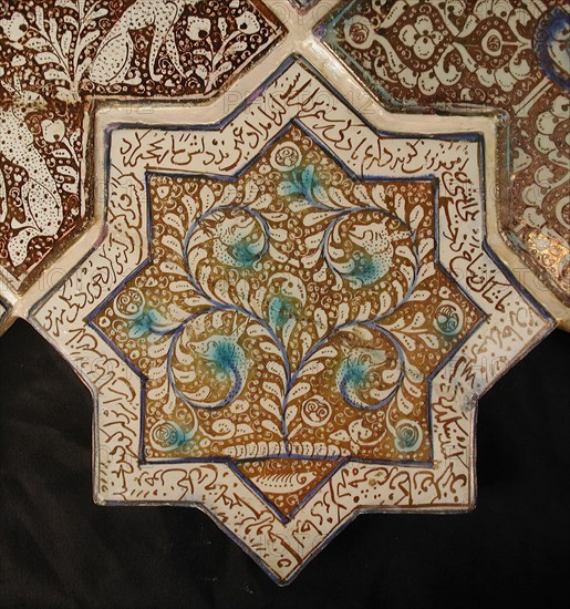Star-Shaped Tile, Iran, 13th-14th century. Waq-waq design of plant whose tendrils develop into heads of animals with text from the Shahnama in which Rustam, one of the tale?s great heroes, is engaged in battle. from an Ilkhanid building.
