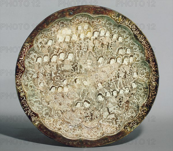Dish depicting a Wedding Procession, Iran, first quarter 13th century. Forty-four figures are clustered around the central veiled woman, probably a bride,
