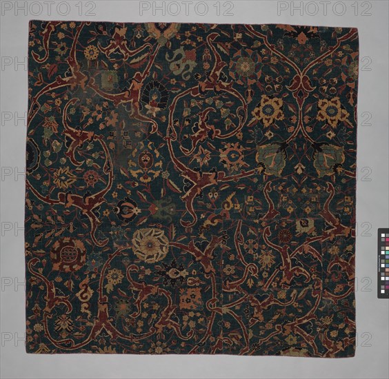 Blue-ground Carpet Fragment with Scrolling Floral Vines, Iran, 17th century.
