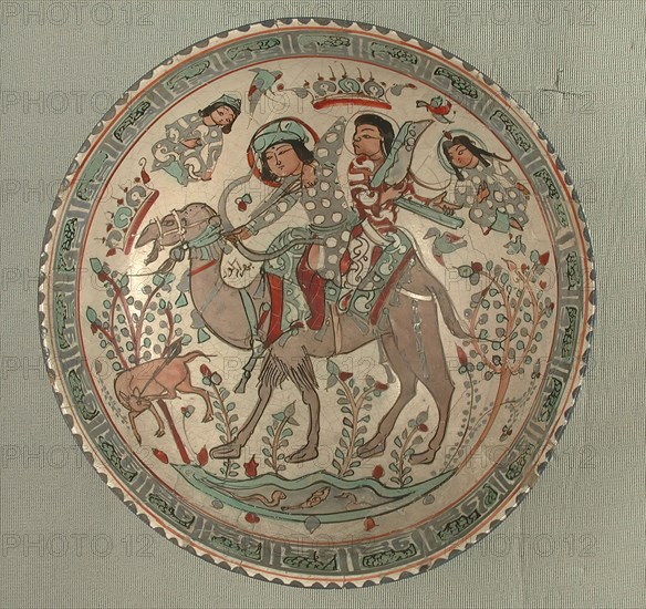 Bowl, Iran, 12th-13th century. Bahram Gur, riding a camel with one of his slaves, Azadeh playing a harp.
