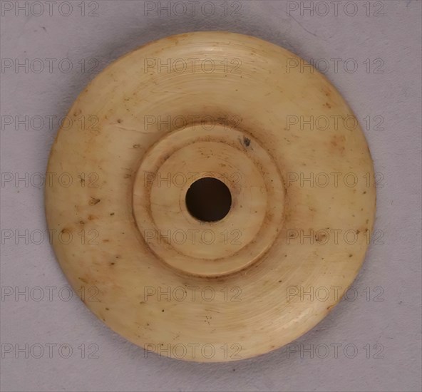 Spindle Whorl, Iran, 9th-10th century.  Excavated at Nishapur, providing evidence the city possessed a thriving textile industry