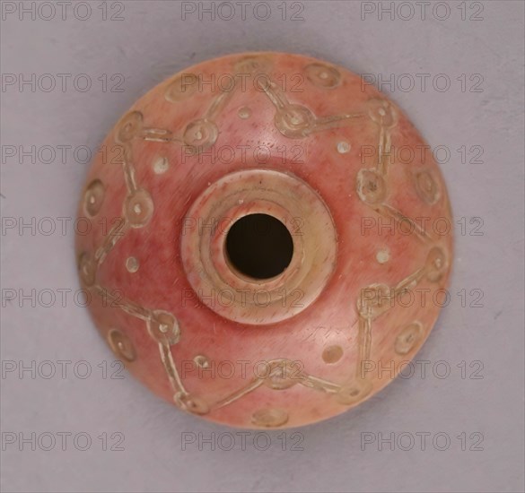 Spindle Whorl, Iran, 9th-10th century.  Excavated at Nishapur, providing evidence the city possessed a thriving textile industry.