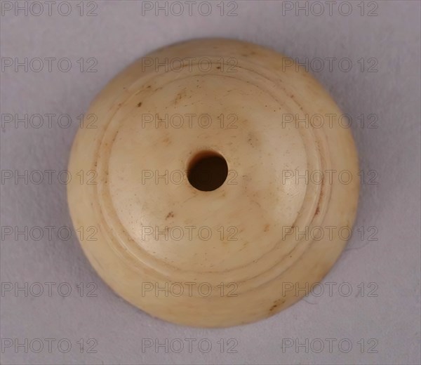 Spindle Whorl, Iran, 9th-10th century.  Excavated at Nishapur, providing evidence the city possessed a thriving textile industry.