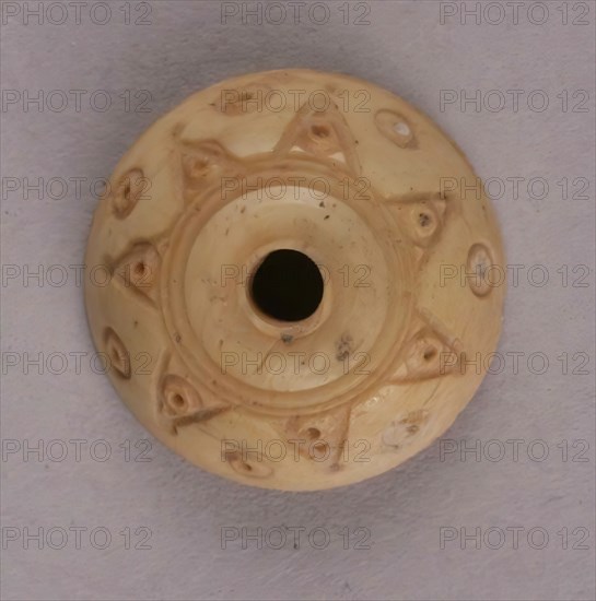 Spindle Whorl, Iran, 9th-10th century.  Excavated at Nishapur, providing evidence the city possessed a thriving textile industry