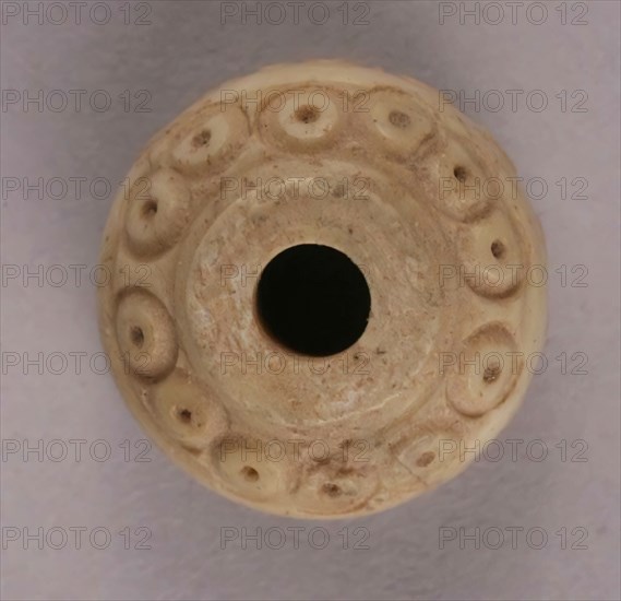 Spindle Whorl, Iran, 9th-10th century.  Excavated at Nishapur, providing evidence the city possessed a thriving textile industry